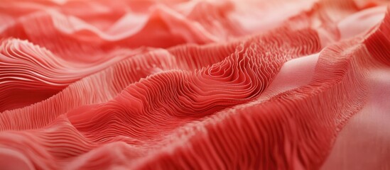 Textured waves of vibrant red textile fabric creating an elegant and dynamic backdrop for fashion and design presentations
