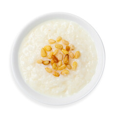 Rice porridge with pine nuts, on a white background, isolated. Top view.