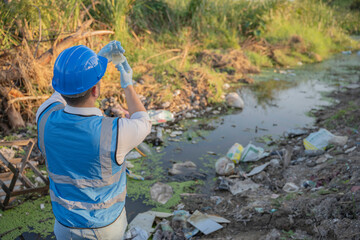 An Environmental Engineer Collects Water Samples from a Polluted Site, Analyzing Contaminants in Community Water Sources, Highlighting Waste Management and Environmental Protection Efforts