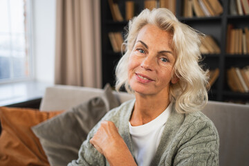 Portrait of confident stylish European middle aged senior woman. Older mature 60s lady smiling at home. Happy attractive senior female looking camera close up face headshot portrait. Happy people