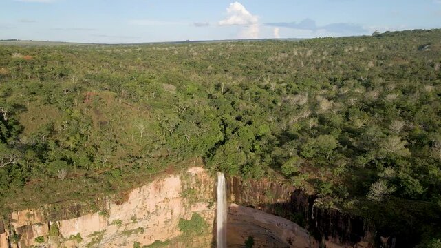 Aerial footage of the V&eacute;u de Noiva waterfall in Chapada dos Guimar&atilde;es, Mato Grosso, Brazil, South America, 4K video.