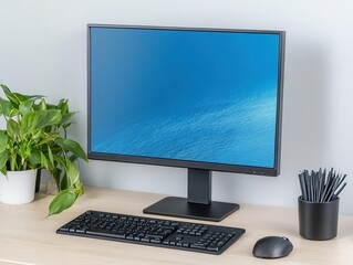 Fototapeta premium Modern Workspace with Computer Monitor, Keyboard, Plants and Accessories