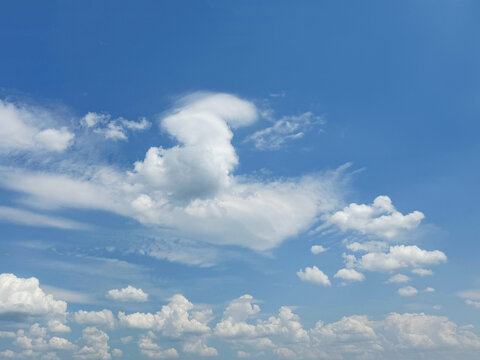 White fluffy clouds in blue sky