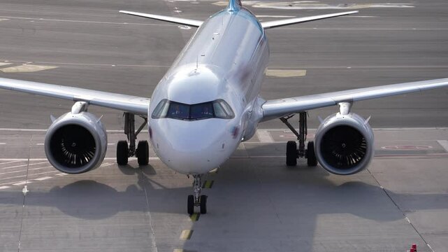 Modern Passenger Airplane arriving at gate at Hamburg Airport