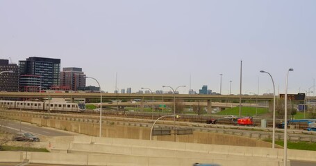 Urban infrastructure showcasing modern buildings, highways, and railway systems, highlighting efficient transportation network, dynamic cityscape, and progress in metropolitan development.