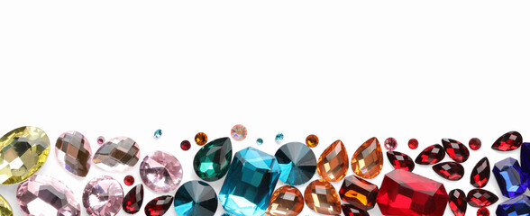 Different shiny gemstones on white background, flat lay. Space for text