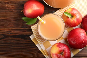 Tasty apple juice and fresh fruits on wooden table, flat lay. Space for text