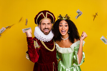 Lively couple in royal costumes enjoying festive decor signifying their modern twist on medieval...