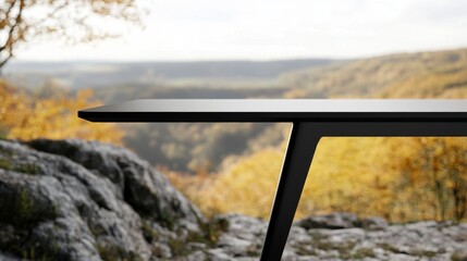 Fototapeta premium Elegant Black Table Against Scenic Autumn Landscape in Nature