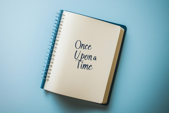 Photo of World Writer's Day celebrated on March 3, a symbolic image of a blank journal with the words "Once Upon a Time" handwritten on the first page, isolated on a solid pastel cream background 