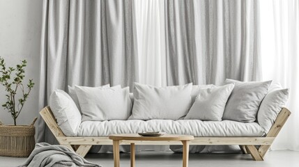 Light gray linen sofa with cushions in minimalist living room.
