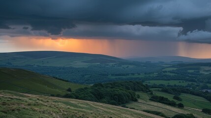 Dramatic sunset over rolling hills during a summer storm.