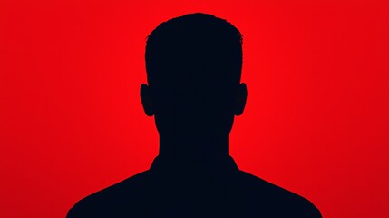 A dark silhouette of a person against a vibrant red background, creating a striking contrast and an air of mystery.