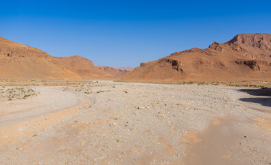 Dry wadi (river) of the Moroccan countryside near the Atlas Mountains
