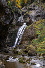 Waterfall of the strait (Estrecho waterfall) in autumn in the Ordesa Valley National Park in Aragon Pyrenees. Huesca, Spain. Ara river waterfalls.
