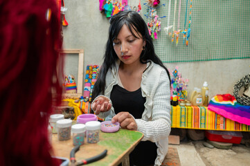 South American indigenous woman doing handicraft work