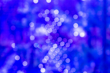 Blue festive Christmas abstract background with bokeh lights and stars. holiday, Christmas and new year