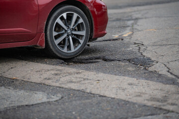 Car driving over a pothole in Marysville, CA