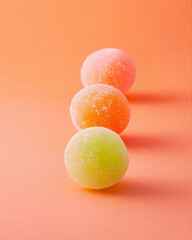 photo of moti, chewy rice candy arranged on pastel background. 