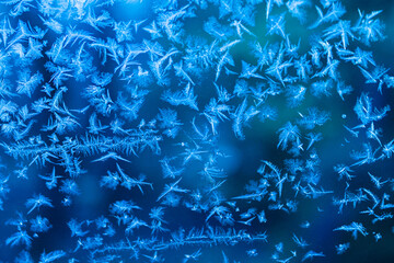 silver abstract Christmas background with frost pattern on glass. Christmas and new year holiday