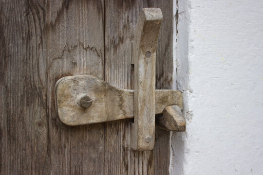 Rustic wooden latch on old door - Powered by Adobe