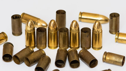 photo of a black pistol and bullets on a black background