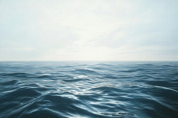 Obraz premium A vast ocean stretching out to the horizon with a clear blue sky in the background