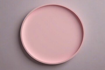 Obraz premium a close up of a pink plate on a gray surface