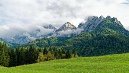 Mystical Peaks Under a Veil of Clouds