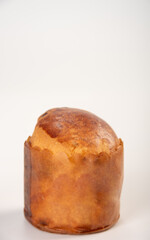 Mini panettone, mini panettone placed on a white surface with a white background, selective focus.