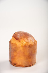 Mini panettone, mini panettone placed on a white surface with a white background, selective focus.