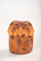 Mini panettone, mini panettone placed on a white surface with a white background, selective focus.