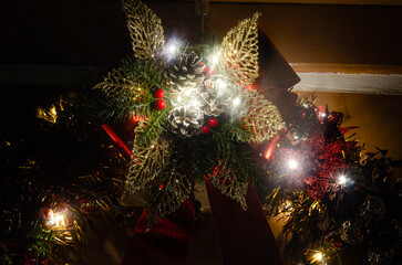 Christmas wreath, details of a beautiful Christmas wreath its decorations and lights, selective...