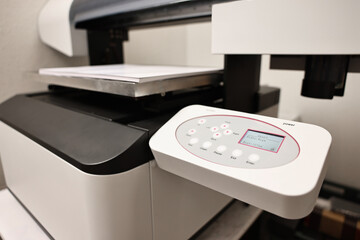 Modern printer in room, closeup. Printing equipment