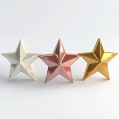 Obraz premium Three metallic stars in white, rose gold, and gold, arranged elegantly on a light background.