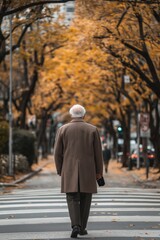 An elderly man walks through a picturesque autumn landscape.