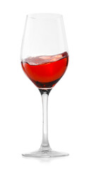 Rose wine splashing in glass on white background