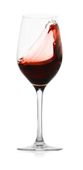 Red wine splashing in glass on white background