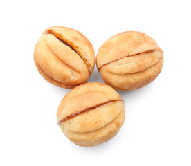 Sweet walnut shaped cookies with boiled condensed milk on white background