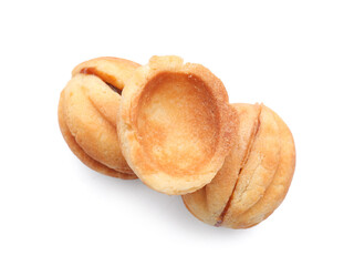 Sweet walnut shaped cookies with boiled condensed milk on white background