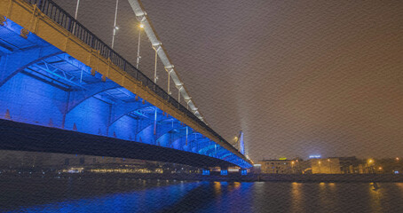 Naklejka premium Bridge is lit up in blue and white lights