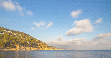 Beautiful blue sky with a few clouds and a calm ocean