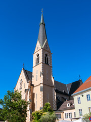 Historic church with steeple against blue sky