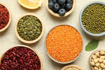 Different superfood products on light table, flat lay
