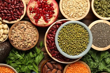 Different superfood products on wooden table, closeup