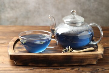 Delicious butterfly pea flower tea on wooden table