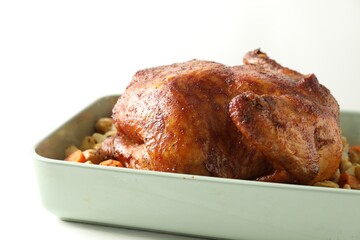 Delicious baked turkey and vegetables in baking dish on white table, closeup