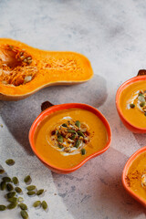 Traditional autumn butternut squash soup with seeds.