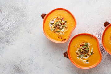 Traditional autumn butternut squash soup with seeds.