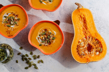 Traditional autumn butternut squash soup with seeds.